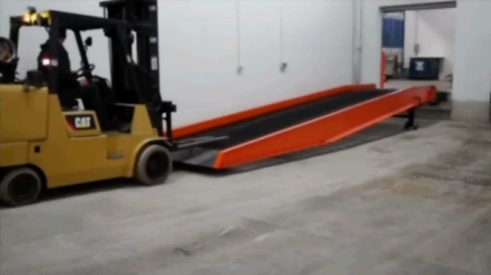 Move the Yard Ramp into position with a forklift